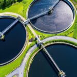 aerial-view-sewage-treatment-plant-dusk-featuring-circular-tanks_187882-8094